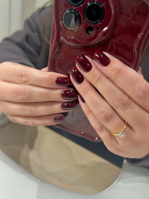 Deep burgundy high-gloss gel nails