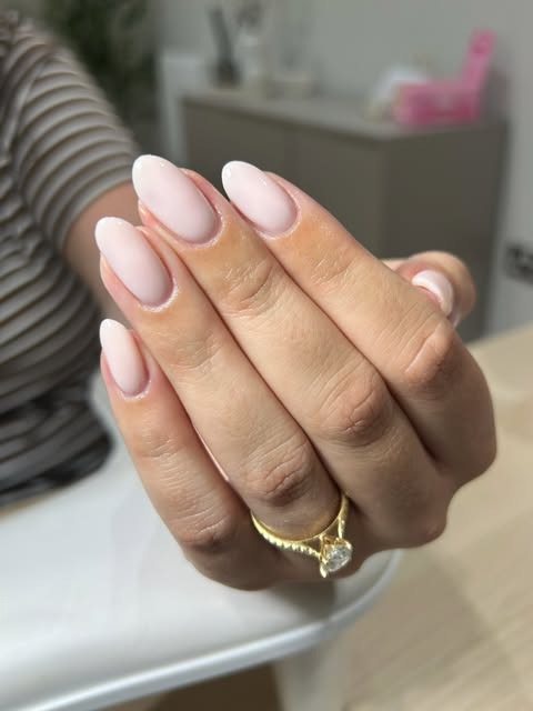 Natural almond nails with a milky-pink builder-gel overlay